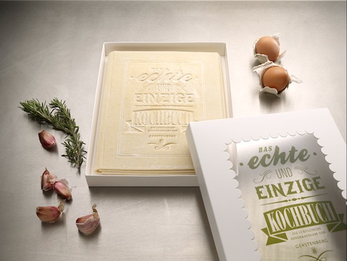 The cookbook comes wrapped in a box and the book pages can be teared off and cooked to prepare lasagna Edible Cookbook 2